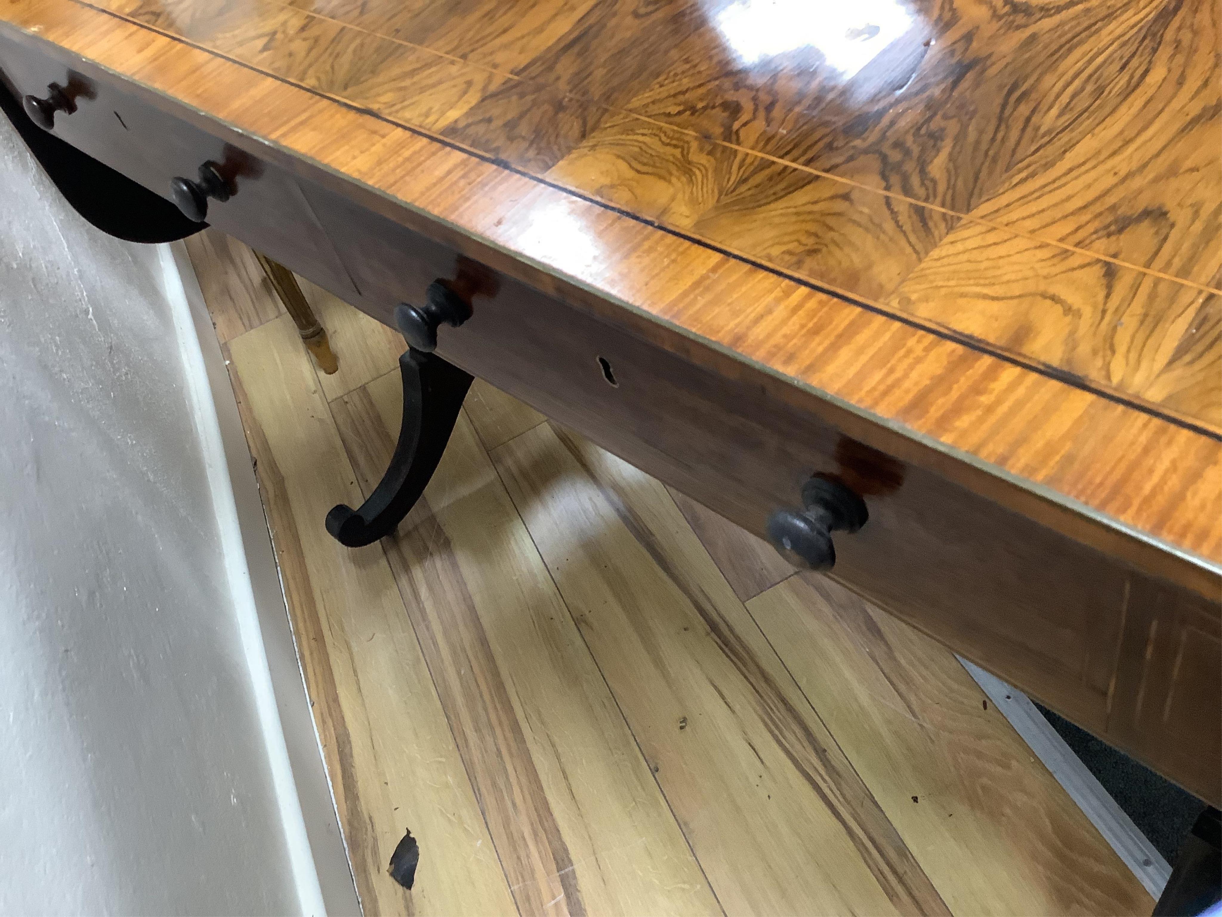A Regency satinwood banded rosewood sofa table, width 92cm, depth 66cm, height 71cm. Condition - fair